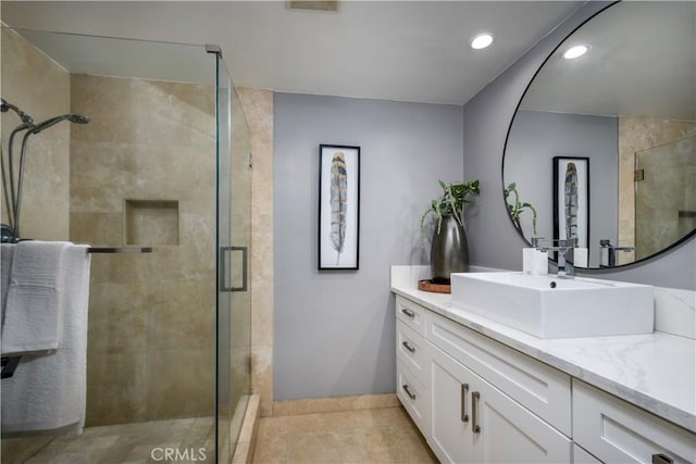 4557 Don Timoteo Dr, Los Angeles, CA 90008 - full bathroom featuring vanity, a shower stall, recessed lighting, and tile patterned floors