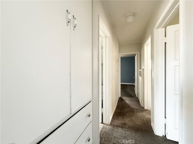 3864 Myers St, Riverside, CA 92503 - corridor featuring dark colored carpet and baseboards