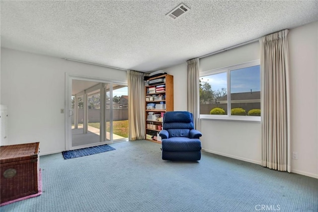 9452 El Valle Ave, Fountain Valley, CA 92708 - sitting room with carpet floors and a textured ceiling