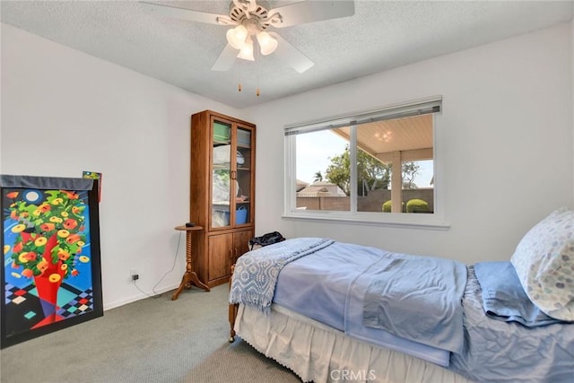 9452 El Valle Ave, Fountain Valley, CA 92708 - bedroom with carpet, a textured ceiling, and ceiling fan