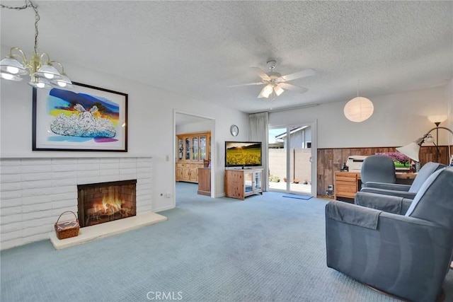 9452 El Valle Ave, Fountain Valley, CA 92708 - carpeted living area with a textured ceiling, a brick fireplace, and a ceiling fan