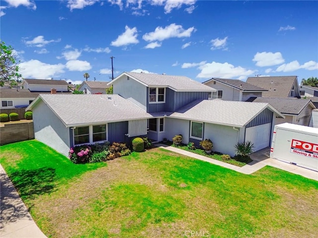 9452 El Valle Ave, Fountain Valley, CA 92708 - traditional-style house with an attached garage, a front yard, roof with shingles, and a residential view