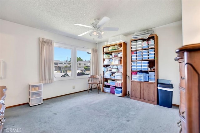 9452 El Valle Ave, Fountain Valley, CA 92708 - living area featuring carpet, ceiling fan, and a textured ceiling