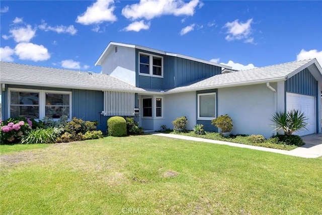 9452 El Valle Ave, Fountain Valley, CA 92708 - view of front of house with an attached garage, a front lawn, and a shingled roof