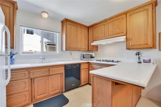 9452 El Valle Ave, Fountain Valley, CA 92708 - kitchen featuring white appliances, under cabinet range hood, a peninsula, light flooring, and tile counters