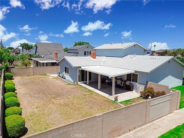 9452 El Valle Ave, Fountain Valley, CA 92708 - rear view of house featuring a patio, a fenced backyard, and roof with shingles