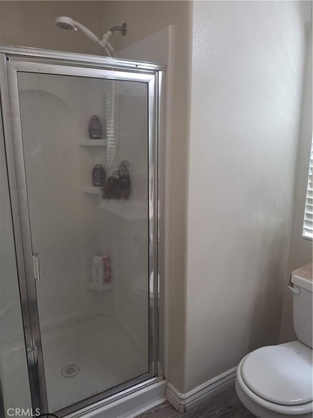 13772 Helena Ave, Victorville, CA 92392 - bathroom with a stall shower and wood finished floors