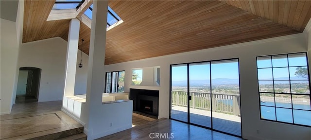 24 Coventry, Newport Beach, CA 92660 - unfurnished living room with wooden ceiling, a fireplace with flush hearth, arched walkways, and high vaulted ceiling