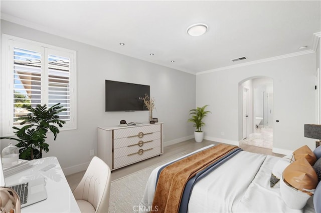 9 Cranwell, Aliso Viejo, CA 92656 - bedroom with arched walkways, ornamental molding, and light wood-type flooring
