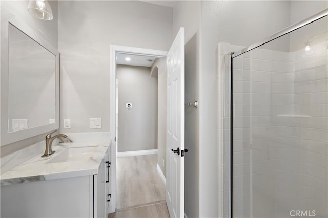 9 Cranwell, Aliso Viejo, CA 92656 - full bath featuring vanity, a stall shower, and wood finished floors