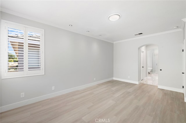 9 Cranwell, Aliso Viejo, CA 92656 - empty room with arched walkways, light wood-style flooring, and ornamental molding