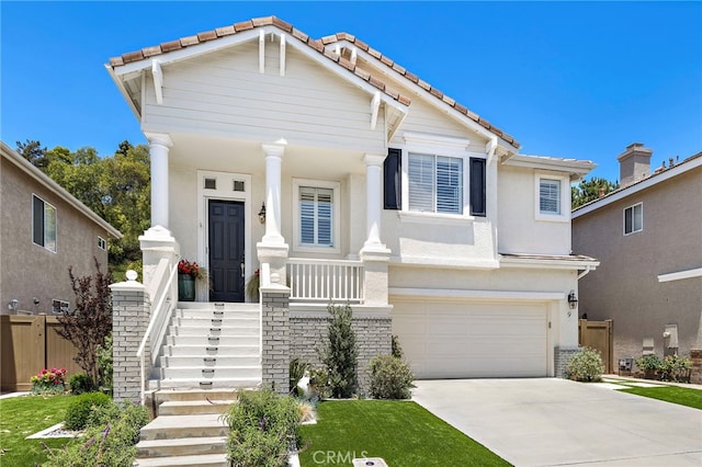 9 Cranwell, Aliso Viejo, CA 92656 - view of front facade featuring a tile roof, an attached garage, driveway, and stucco siding