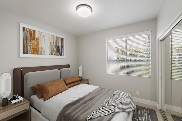 9 Cranwell, Aliso Viejo, CA 92656 - bedroom with light wood-type flooring and multiple windows