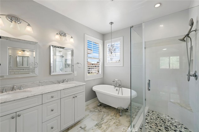 9 Cranwell, Aliso Viejo, CA 92656 - bathroom with a shower stall, double vanity, a freestanding bath, and marble look tile flooring