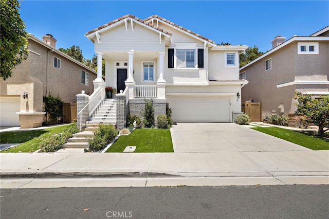 9 Cranwell, Aliso Viejo, CA 92656 - view of front of house with a tiled roof, an attached garage, covered porch, concrete driveway, and stairway