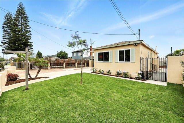 1446 Ravenna Ave, Wilmington, CA 90744 - back of house with stucco siding and a gate