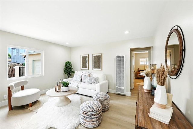 1446 Ravenna Ave, Wilmington, CA 90744 - living room with a heating unit, plenty of natural light, light wood-type flooring, and recessed lighting