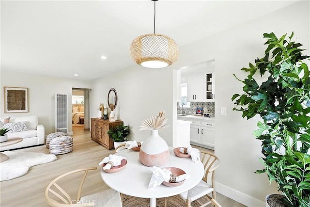 1446 Ravenna Ave, Wilmington, CA 90744 - dining space featuring light wood-style floors, a heating unit, and recessed lighting