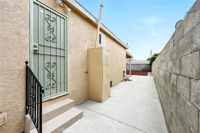 1446 Ravenna Ave, Wilmington, CA 90744 - property entrance with stucco siding and a patio