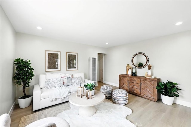 1446 Ravenna Ave, Wilmington, CA 90744 - living area featuring a heating unit, wood finished floors, and recessed lighting