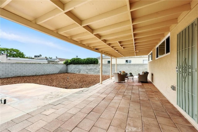 1446 Ravenna Ave, Wilmington, CA 90744 - fenced backyard featuring a patio and an outdoor hangout area