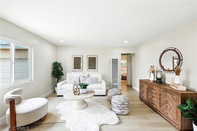 1446 Ravenna Ave, Wilmington, CA 90744 - living area featuring a heating unit, light wood-style flooring, and recessed lighting