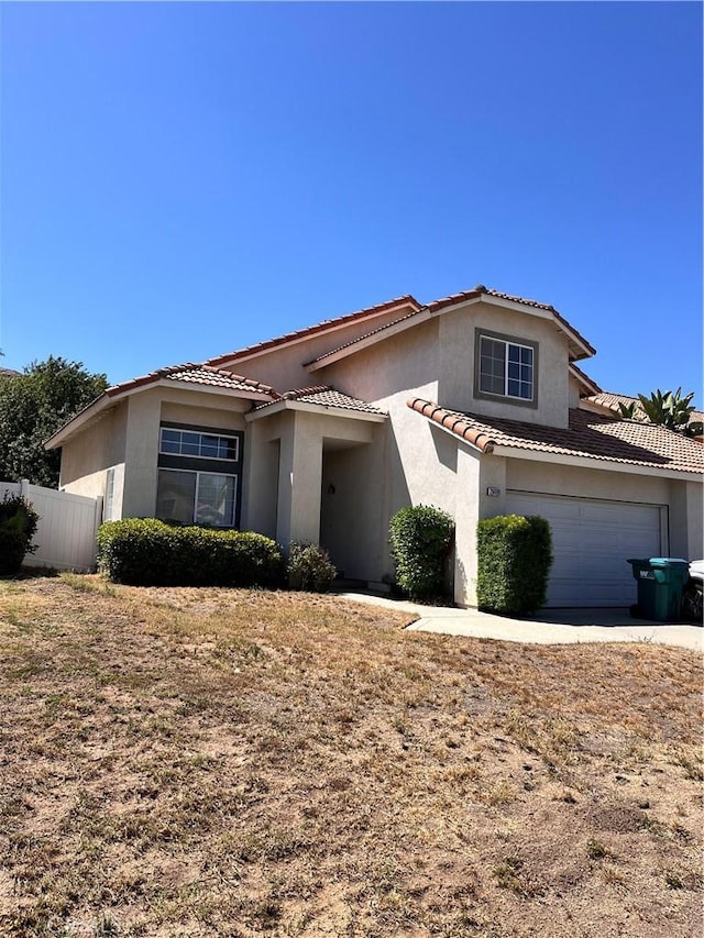 28499 Forest Oaks Way, Moreno Valley, CA 92555 - mediterranean / spanish-style house with stucco siding, a tiled roof, and concrete driveway