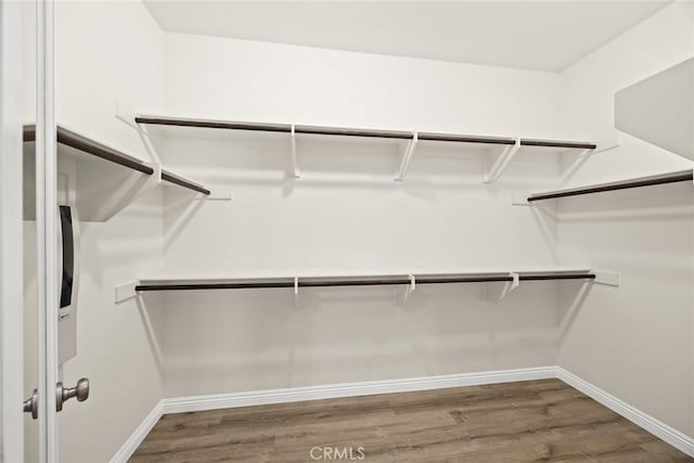 6792 Vanderbilt St, Chino, CA 91710 - walk in closet with wood finished floors
