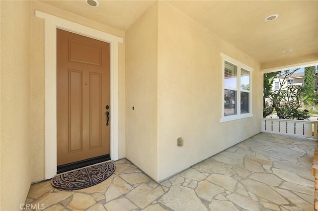 6792 Vanderbilt St, Chino, CA 91710 - doorway to property featuring stucco siding