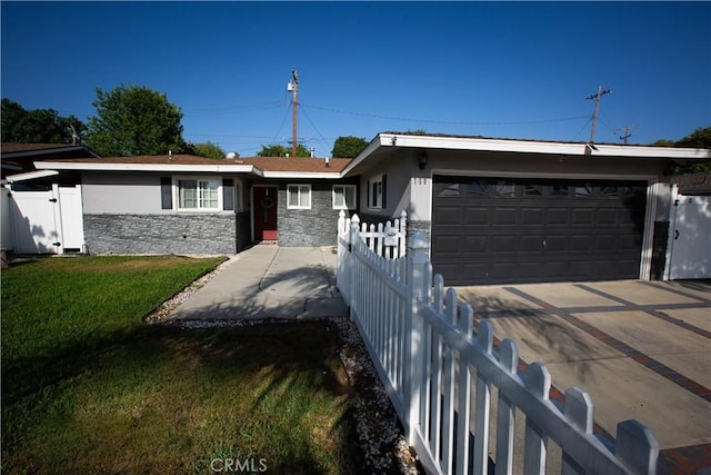 750 Durham St, La Habra, CA 90631 - single story home featuring stone siding, an attached garage, driveway, and stucco siding