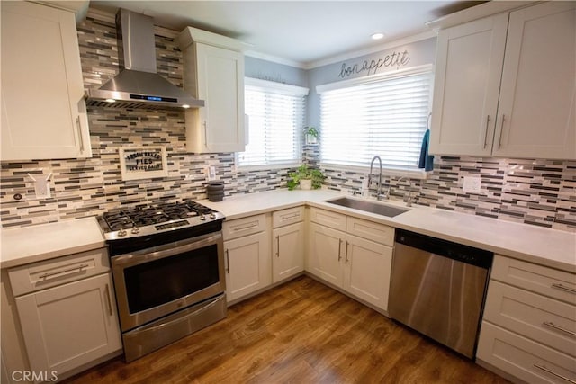 750 Durham St, La Habra, CA 90631 - kitchen with stainless steel appliances, wall chimney exhaust hood, ornamental molding, light countertops, and tasteful backsplash