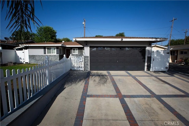750 Durham St, La Habra, CA 90631 - ranch-style home featuring stone siding, an attached garage, and concrete driveway