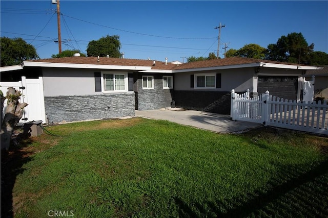 750 Durham St, La Habra, CA 90631 - view of front of property with stone siding, a garage, and stucco siding