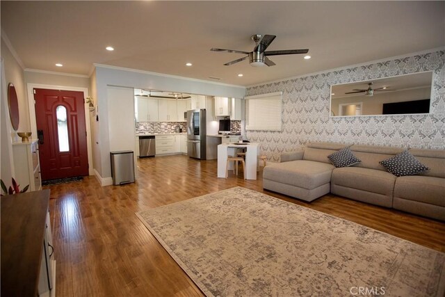 750 Durham St, La Habra, CA 90631 - living room featuring a ceiling fan, ornamental molding, wood finished floors, wallpapered walls, and recessed lighting