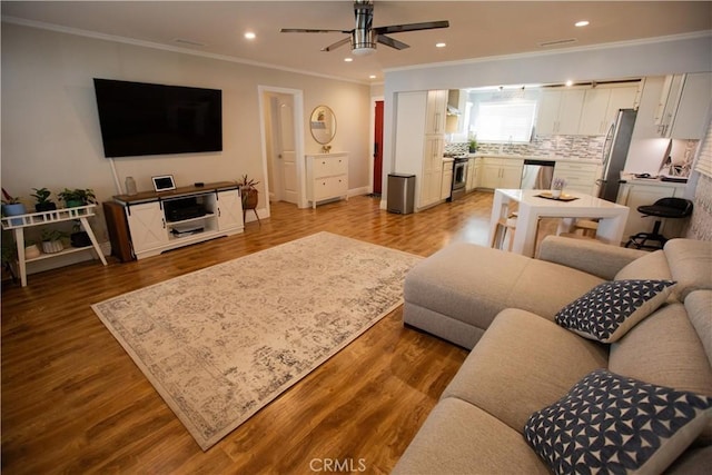 750 Durham St, La Habra, CA 90631 - living room featuring crown molding, a ceiling fan, recessed lighting, and wood finished floors