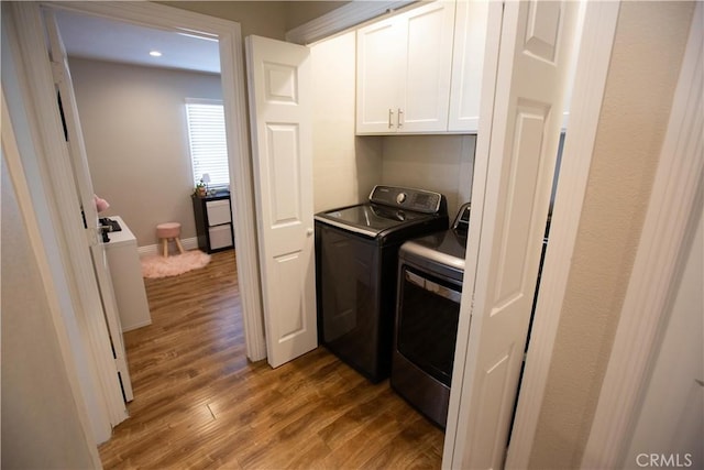 750 Durham St, La Habra, CA 90631 - washroom featuring washing machine and dryer, cabinet space, light wood finished floors, and recessed lighting