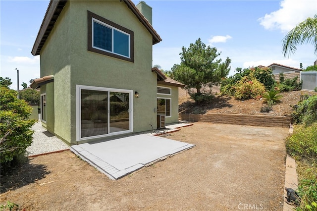 6923 Lamar Ct, Rancho Cucamonga, CA 91701 - rear view of property with stucco siding and a patio