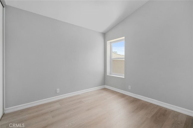 6923 Lamar Ct, Rancho Cucamonga, CA 91701 - spare room with light wood finished floors and lofted ceiling