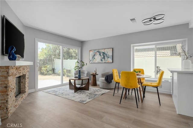 6923 Lamar Ct, Rancho Cucamonga, CA 91701 - living room featuring light wood-type flooring and a fireplace