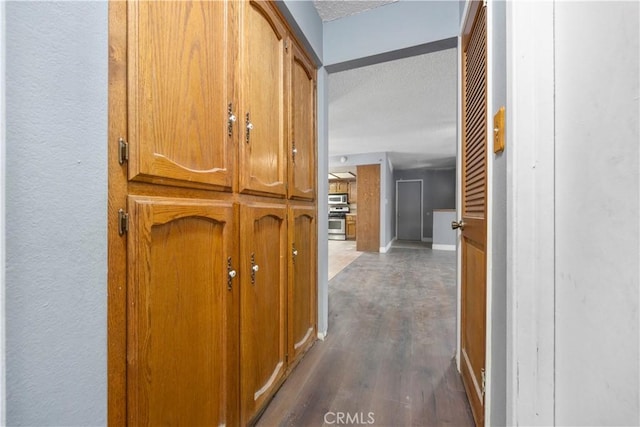 5013 Stancliff St, Bakersfield, CA 93307 - hall with a textured ceiling and wood finished floors
