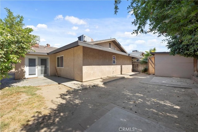 5013 Stancliff St, Bakersfield, CA 93307 - view of property exterior with a patio, stucco siding, and french doors