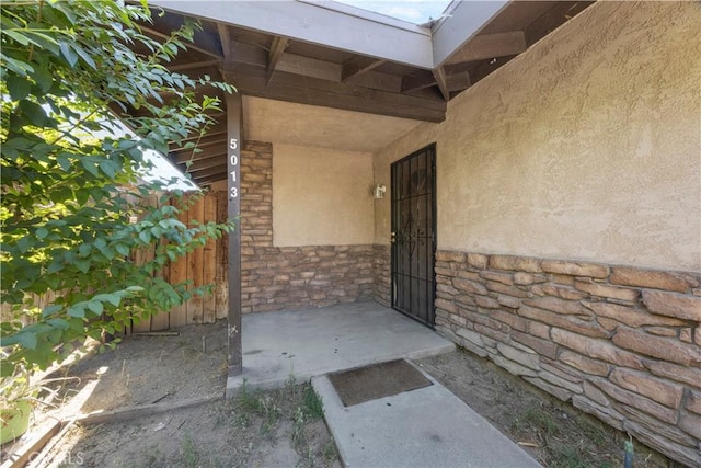 5013 Stancliff St, Bakersfield, CA 93307 - doorway to property featuring stone siding and stucco siding