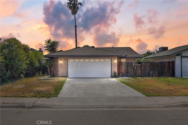 5013 Stancliff St, Bakersfield, CA 93307 - view of front of home featuring concrete driveway and an attached garage