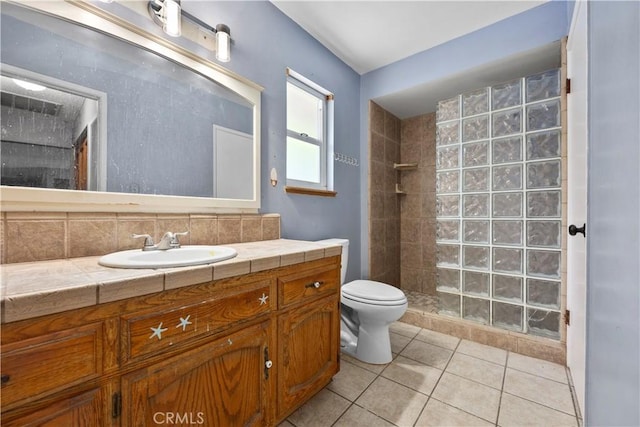 5013 Stancliff St, Bakersfield, CA 93307 - bathroom with tiled shower, vanity, and tile patterned floors