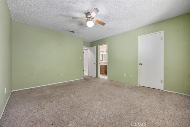5013 Stancliff St, Bakersfield, CA 93307 - unfurnished bedroom with carpet flooring, ensuite bath, a textured ceiling, and a ceiling fan