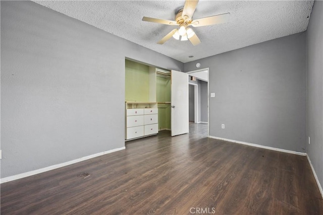 5013 Stancliff St, Bakersfield, CA 93307 - unfurnished bedroom with a textured ceiling, dark wood-type flooring, a closet, and a ceiling fan