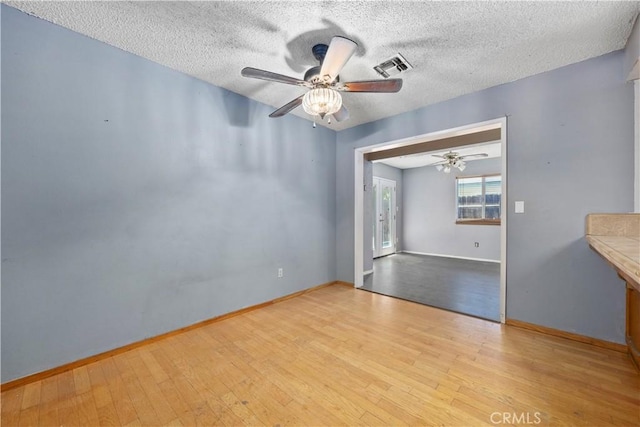 5013 Stancliff St, Bakersfield, CA 93307 - spare room with ceiling fan, wood finished floors, and a textured ceiling