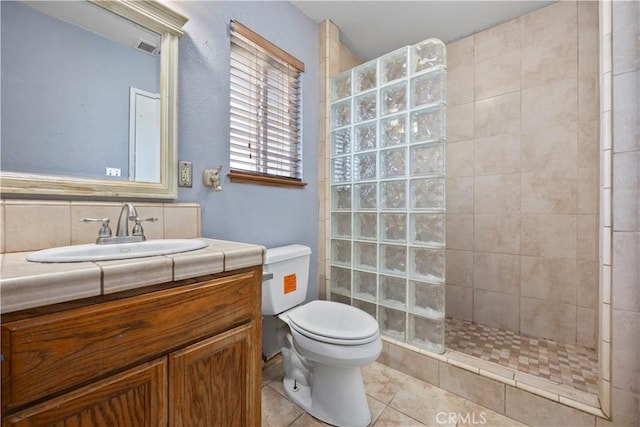 5013 Stancliff St, Bakersfield, CA 93307 - bathroom featuring a walk in shower, vanity, and tile patterned floors