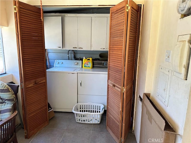 12939 3rd St, Clearlake Oaks, CA 95423 - washroom featuring cabinet space, separate washer and dryer, and tile patterned floors