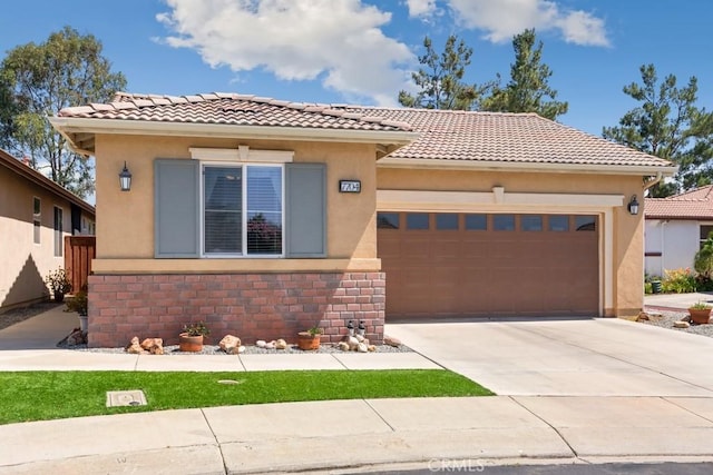 7704 Couples Way, Hemet, CA 92545 - mediterranean / spanish-style home featuring a tiled roof, a garage, concrete driveway, and stucco siding